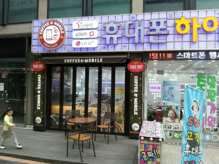 80. Coffee & Mobile Free Cafe, in Jangsan, Busan. "Free Cafe"? Does that mean I can leave my wallet at home? Also, am I the only one who thinks their sign looks like the Arm & Hammer logo?